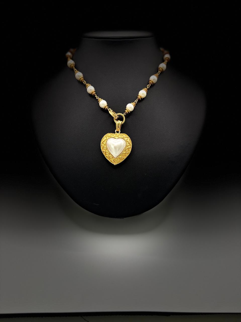 HALF HEART SHAPE PEARL 67.57 GRMS AND K18 WITH GGS CERTIFICATE