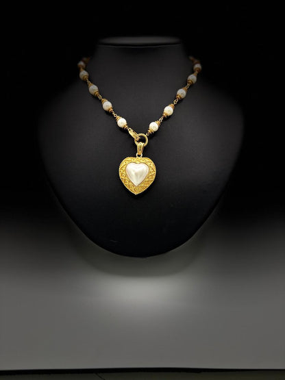 HALF HEART SHAPE PEARL 67.57 GRMS AND K18 WITH GGS CERTIFICATE
