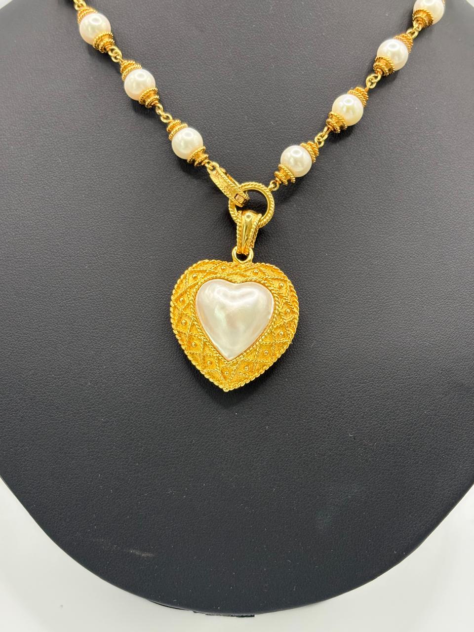 HALF HEART SHAPE PEARL 67.57 GRMS AND K18 WITH GGS CERTIFICATE