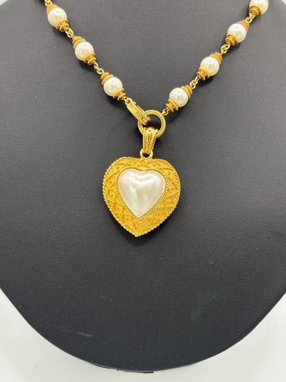HALF HEART SHAPE PEARL 67.57 GRMS AND K18 WITH GGS CERTIFICATE