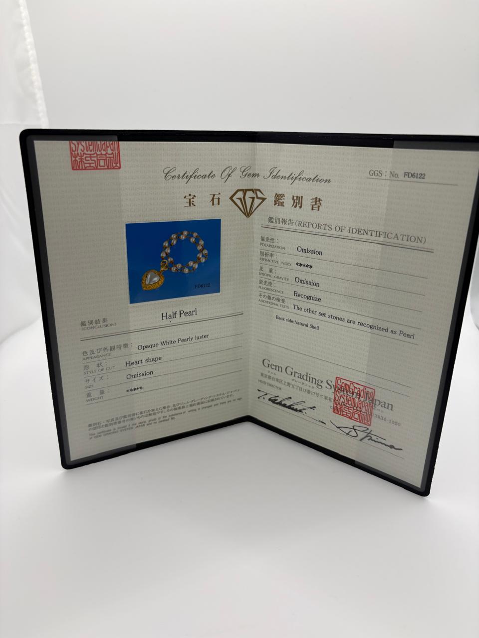 HALF HEART SHAPE PEARL 67.57 GRMS AND K18 WITH GGS CERTIFICATE